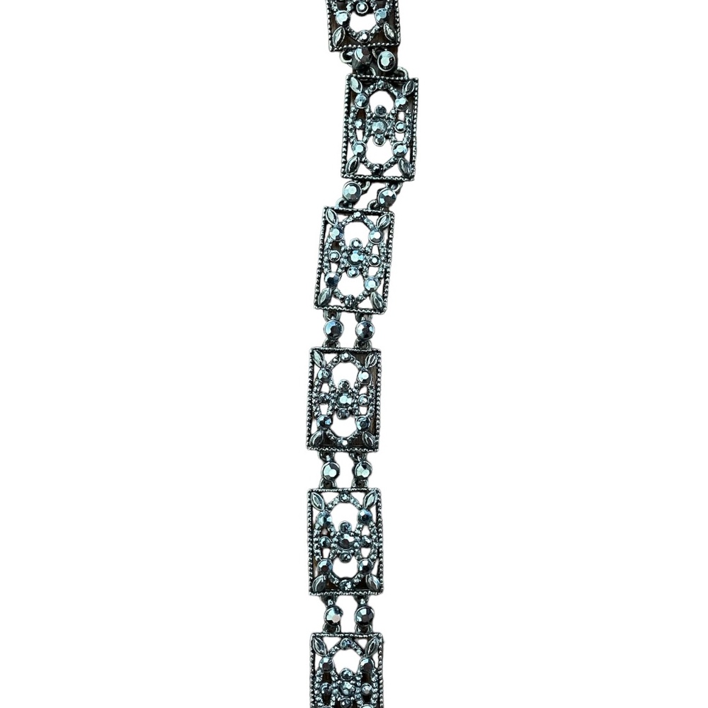 A signed MONET gunmetal link bracelet.